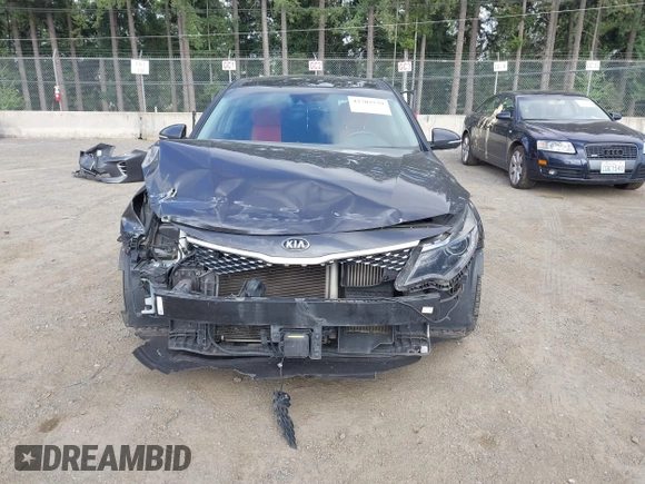 2016 Kia Optima SX Turbo z VIN 5XXGW4L28GG010897, wystawiony jako IAAI lot #42703779 z przebiegiem 121 918 mil mil oraz . Historia ofert i sprzedaży dostępna na DreamBid. Obrazek 13.