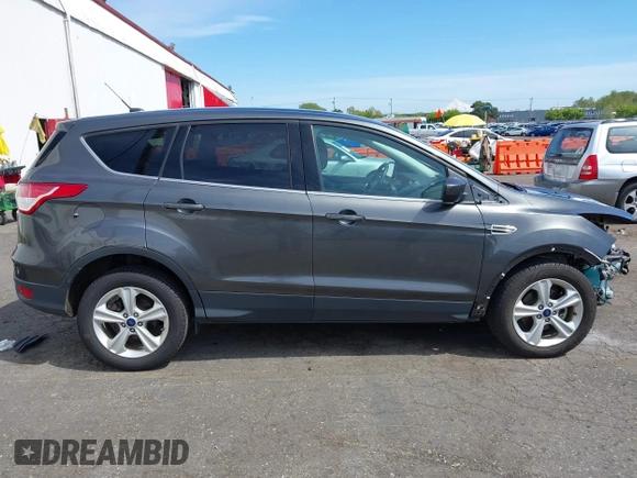 2015 Ford Escape SE with VIN 1FMCU0G75FUB31989, listed as a IAAI auction lot 42040121 with 87,068 mi miles and . Bid and sale history available at DreamBid. Image 14.