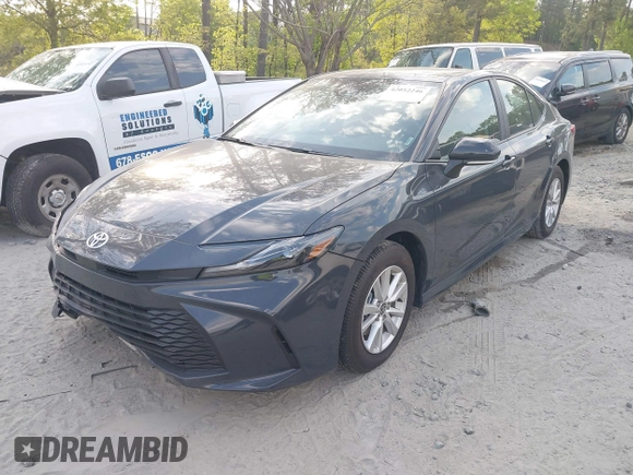 2025 Toyota Camry LE with VIN 4T1DAACKXSU541257, listed as a IAAI auction lot 42052246 with 13,585 mi miles and . Bid and sale history available at DreamBid. Image 2.