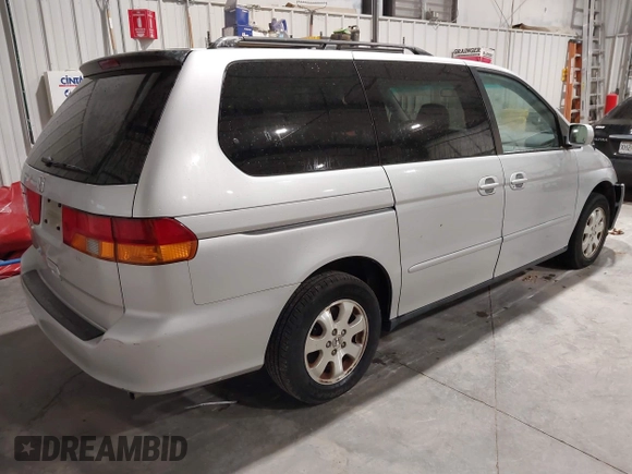 2003 Honda Odyssey EX with VIN 5FNRL18673B009670, listed as a IAAI auction lot 42130172 with 218,391 mi miles and . Bid and sale history available at DreamBid. Image 4.