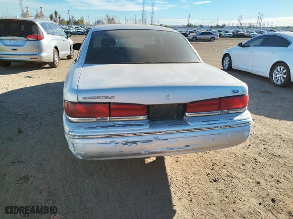 1996 Ford Crown Victoria LX with VIN 2FALP74W2TX172767, listed as a Copart auction lot 82534863 with 257,277 mi miles and Clean Title. Bid and sale history available at carsss.com. Image 6.