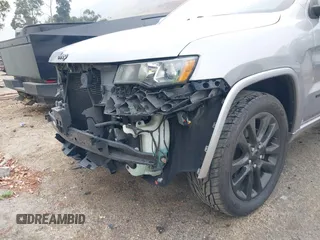 2017 Jeep Grand Cherokee Laredo with VIN 1C4RJEAG0HC702195, listed as a IAAI auction lot 42427597 with 104,403 mi miles and . Bid and sale history available at DreamBid. Image 6.