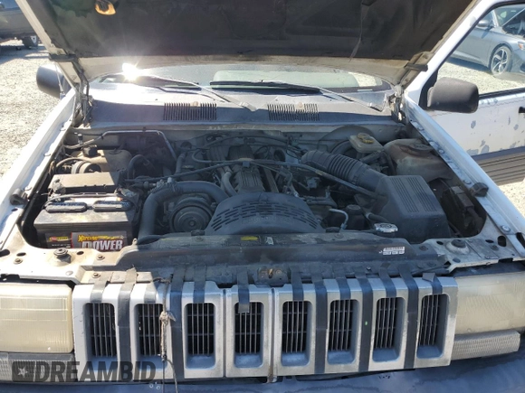 1993 Jeep Grand Cherokee Laredo с VIN 1J4GZ58S2PC654248, выставлен на аукционе Copart как лот 61259735 с пробегом 251 360 миль миль и Списание • Salvage title. История ставок и продаж доступна на DreamBid. Изображение 12.