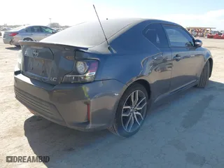 2014 Scion tC with VIN JTKJF5C74E3085237, listed as a IAAI auction lot 41788862 with 106,807 mi miles. Bid and sale history available at carsss.com. Image 4.