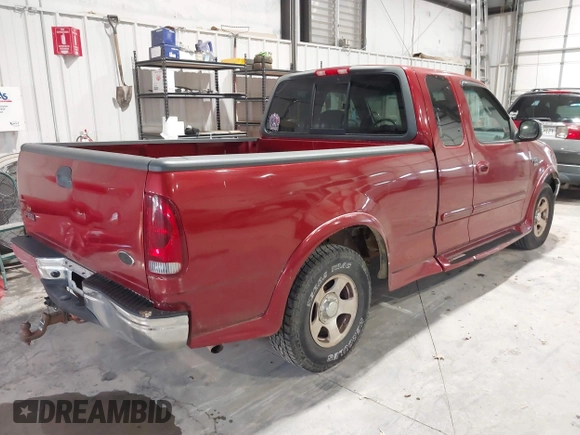 2002 Ford F-150 XL with VIN 1FTRX17L12NA36715, listed as a IAAI auction lot 41850555 with 174,012 mi miles. Bid and sale history available at carsss.com. Image 4.