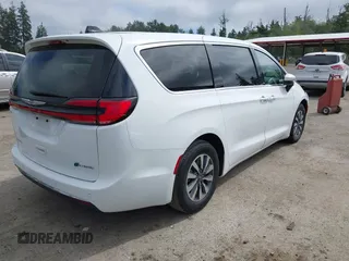2023 Chrysler Pacifica Hybrid Touring L with VIN 2C4RC1L77PR541513, listed as a IAAI auction lot 42433421 with 53,979 mi miles and . Bid and sale history available at DreamBid. Image 4.