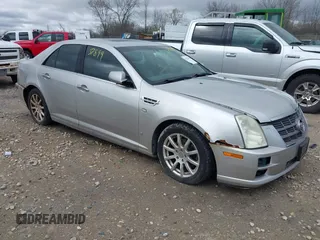 2008 Cadillac STS RWD w/1SB with VIN 1G6DW67V080126989, listed as a IAAI auction lot 42137899 with 123,638 mi miles. Bid and sale history available at carsss.com. Image 1.