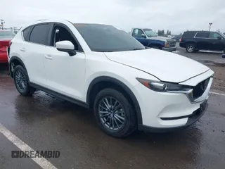 2020 Mazda CX-5 Touring with VIN JM3KFACM0L0738615, listed as a IAAI auction lot 41923923 with 52,599 mi miles. Bid and sale history available at carsss.com. Image 1.