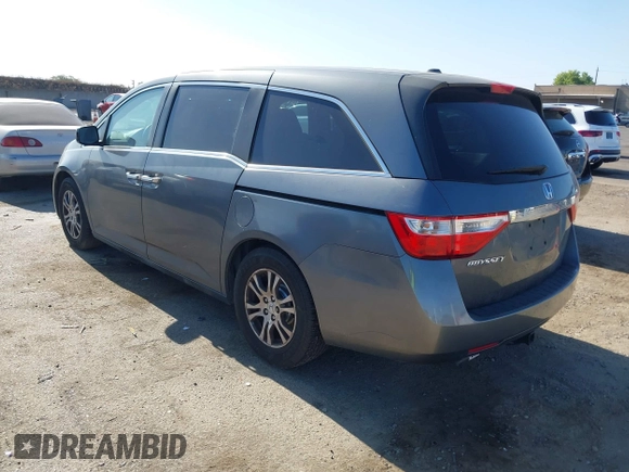 2012 Honda Odyssey EX-L with VIN 5FNRL5H6XCB061026, listed as a IAAI auction lot 42574612 with 144,480 mi miles and . Bid and sale history available at DreamBid. Image 3.
