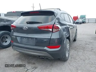 2016 Hyundai Tucson Sport with VIN KM8J33A26GU189300, listed as a IAAI auction lot 41372422 with 94,848 mi miles. Bid and sale history available at carsss.com. Image 4.