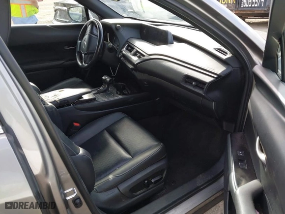 2021 Lexus UX with VIN JTHX3JBH4M2043263, listed as a IAAI auction lot 41671055 with 100,589 mi miles. Bid and sale history available at carsss.com. Image 5.