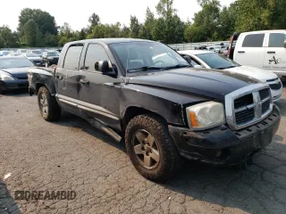 2005 Dodge Dakota Laramie with VIN 1D7HW58N65S161629, listed as a Copart auction lot 66570164 with 205,984 mi miles and Salvage Title. Bid and sale history available at carsss.com. Image 4.
