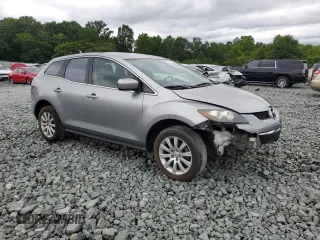 2010 Mazda CX-7 SV z VIN JM3ER2W53A0301123, wystawiony jako Copart lot #58711605 z przebiegiem 236 428 mil mil oraz Szkoda całkowita • Salvage title. Historia ofert i sprzedaży dostępna na DreamBid. Obrazek 4.