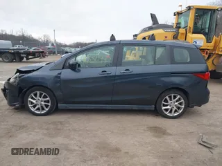2012 Mazda 5 Touring with VIN JM1CW2CL6C0107233, listed as a IAAI auction lot 41332199 with 130,428 mi miles and . Bid and sale history available at DreamBid. Image 14.