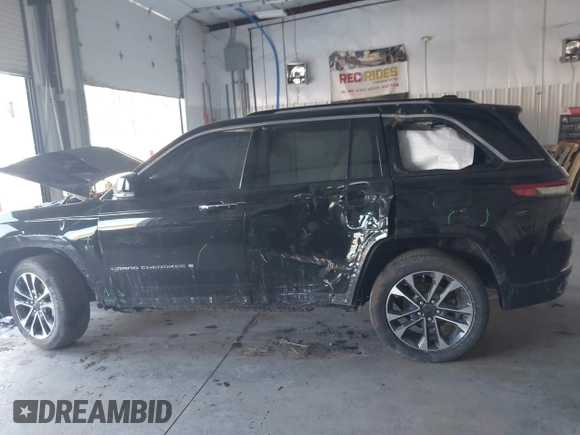 2023 Jeep Grand Cherokee Overland with VIN 1C4RJHDG5PC507978, listed as a IAAI auction lot 41394199 with 57,323 mi miles and . Bid and sale history available at DreamBid. Image 14.