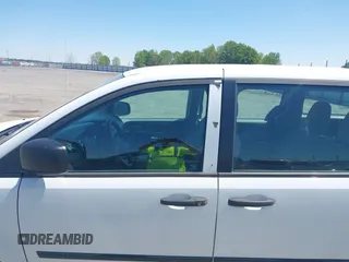 2015 Dodge Grand Caravan American Value with VIN 2C4RDGBG1FR748088, listed as a IAAI auction lot 42052160 with 248,540 mi miles and . Bid and sale history available at DreamBid. Image 6.