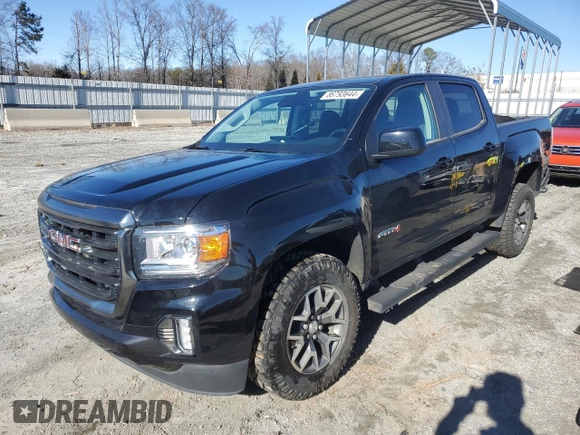 2021 GMC Canyon 4WD AT4 w/Leather with VIN 1GTG6FEN4M1155641, listed as a Copart auction lot 86793644 with 36,940 mi miles and Salvage Title. Bid and sale history available at carsss.com. Image 1.