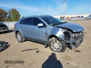2014 Cadillac SRX Luxury Collection z VIN 3GYFNBE30ES615023, wystawiony jako IAAI lot #40932254 z przebiegiem Nie podano mil oraz . Historia ofert i sprzedaży dostępna na DreamBid. Obrazek 1.