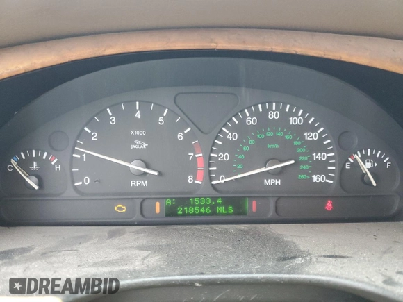 2002 Jaguar S-Type with VIN SAJDA01P12GM27242, listed as a Copart auction lot 88579215 with 218,546 mi miles and Salvage Title. Bid and sale history available at DreamBid. Image 9.