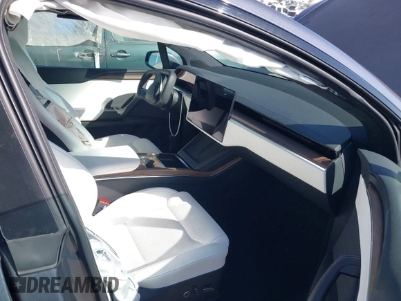 2023 Tesla Model X with VIN 7SAXCBE50PF378548, listed as a IAAI auction lot 41698357 with Not Provided miles and . Bid and sale history available at DreamBid. Image 5.