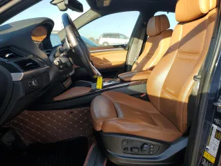 2014 BMW X6 50i z VIN 5UXFG8C53EL592803, wystawiony jako Copart lot #79621904 z przebiegiem 154 595 mil mil oraz Szkoda całkowita • Salvage title. Historia ofert i sprzedaży dostępna na DreamBid. Obrazek 7.