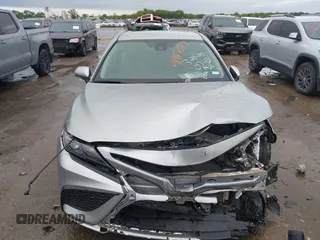 2022 Toyota Camry SE with VIN 4T1G11AKXNU697576, listed as a IAAI auction lot 41947082 with 67,199 mi miles and . Bid and sale history available at DreamBid. Image 12.
