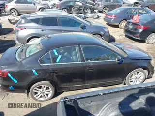 2017 Volkswagen Jetta SEL z VIN 3VWL17AJ5HM246543, wystawiony jako IAAI lot #41650614 z przebiegiem 112 168 mil mil oraz . Historia ofert i sprzedaży dostępna na DreamBid. Obrazek 13.