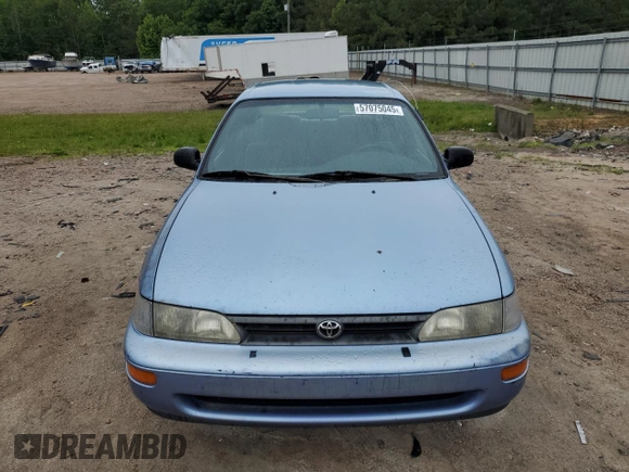 1995 Toyota Corolla DX with VIN 2T1AE09B5SC127586, listed as a Copart auction lot 57075045 with 244,969 mi miles and Salvage title. Bid and sale history available at DreamBid. Image 5.