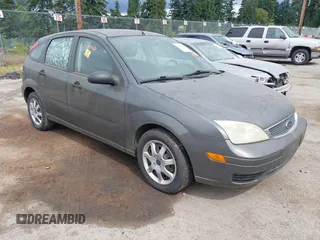 2005 Ford Focus S z VIN 3FAFP37N35R159455, wystawiony jako IAAI lot #42542226 z przebiegiem 158 572 mil mil oraz . Historia ofert i sprzedaży dostępna na DreamBid. Obrazek 1.
