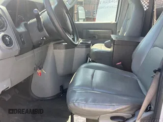 2013 Ford Econoline Cargo Commercial with VIN 1FTNE1ELXDDA44828, listed as a IAAI auction lot 42219008 with 174,965 mi miles. Bid and sale history available at carsss.com. Image 1.