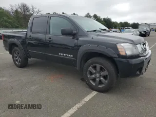 2015 Nissan Titan SV with VIN 1N6AA0EC2FN503980, listed as a Copart auction lot 64664665 with 124,589 mi miles and Clean title. Bid and sale history available at DreamBid. Image 4.