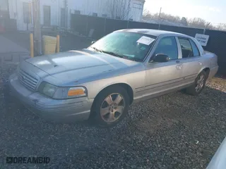 2005 Ford Crown Victoria LX with VIN 2FAFP74W95X166416, listed as a IAAI auction lot 41526872 with 195,589 mi miles. Bid and sale history available at carsss.com. Image 2.