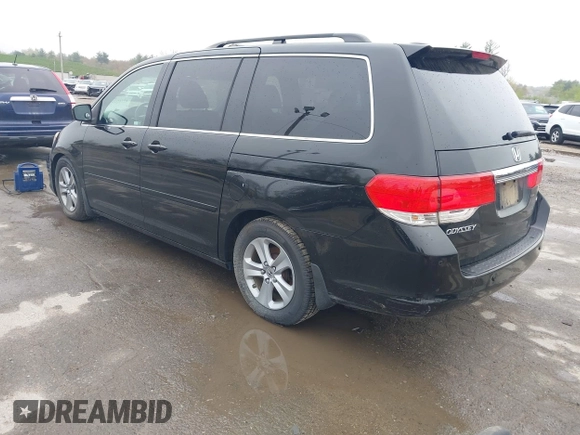 2010 Honda Odyssey Touring with VIN 5FNRL3H97AB056975, listed as a IAAI auction lot 42169269 with 183,483 mi miles. Bid and sale history available at carsss.com. Image 3.