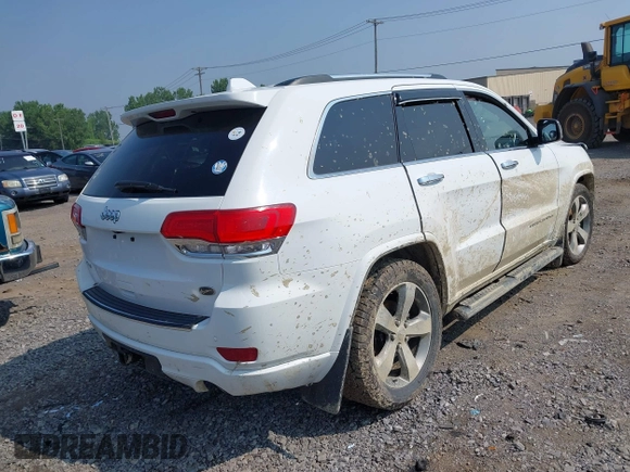 2015 Jeep Grand Cherokee Overland with VIN 1C4RJFCGXFC880096, listed as a IAAI auction lot 42706085 with 74,044 mi miles and . Bid and sale history available at DreamBid. Image 4.