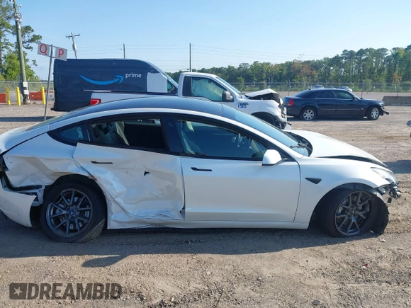 2023 Tesla Model 3 with VIN 5YJ3E1EA9PF557880, listed as a IAAI auction lot 42481413 with 40,582 mi miles and . Bid and sale history available at DreamBid. Image 12.