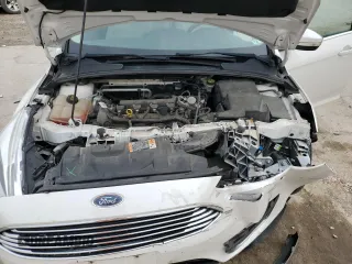 2016 Ford Focus Titanium z VIN 1FADP3N23GL345904, wystawiony jako Copart lot #60139525 z przebiegiem 97 572 mil mil oraz Szkoda całkowita • Salvage title. Historia ofert i sprzedaży dostępna na DreamBid. Obrazek 11.