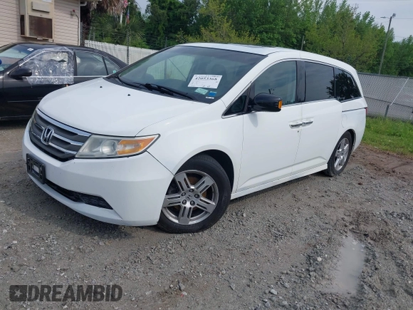 2011 Honda Odyssey Touring with VIN 5FNRL5H90BB066177, listed as a IAAI auction lot 42053368 with 239,205 mi miles and . Bid and sale history available at DreamBid. Image 2.