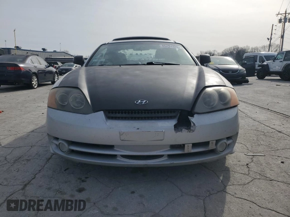 2003 Hyundai Tiburon GT z VIN KMHHN65F13U102985, wystawiony jako Copart lot #45294325 z przebiegiem 326 919 mil mil oraz Szkoda całkowita • Salvage title. Historia ofert i sprzedaży dostępna na DreamBid. Obrazek 5.