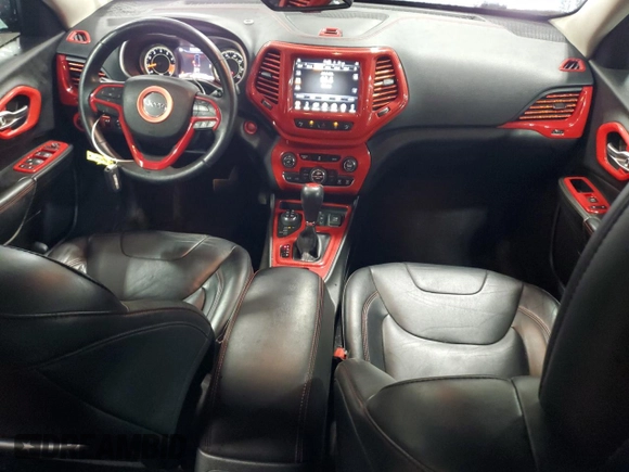 2014 Jeep Cherokee Trailhawk with VIN 1C4PJMBSXEW187981, listed as a Copart auction lot 56711885 with 157,317 mi miles and Salvage title. Bid and sale history available at DreamBid. Image 8.
