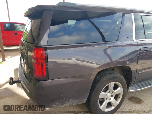 2015 Chevrolet Suburban LTZ with VIN 1GNSCKKC7FR272138, listed as a IAAI auction lot 42047823 with 198,314 mi miles and . Bid and sale history available at DreamBid. Image 4.