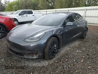2021 Tesla Model 3 Performance z VIN 5YJ3E1EC0MF059645, wystawiony jako Copart lot #50683995 z przebiegiem 28 071 mil mil oraz Szkoda całkowita • Salvage title. Historia ofert i sprzedaży dostępna na DreamBid. Obrazek 1.