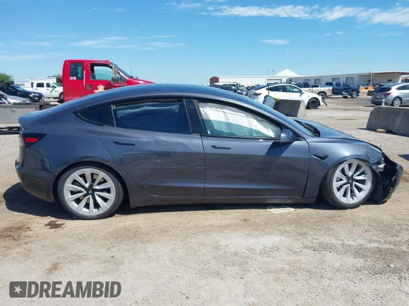 2023 Tesla Model 3 with VIN 5YJ3E1EAXPF617388, listed as a IAAI auction lot 42218748 with Not provided miles and . Bid and sale history available at DreamBid. Image 13.
