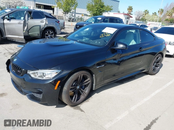 2015 BMW M4 with VIN WBS3R9C58FK334247, listed as a IAAI auction lot 41940211 with 125,881 mi miles. Bid and sale history available at carsss.com. Image 2.