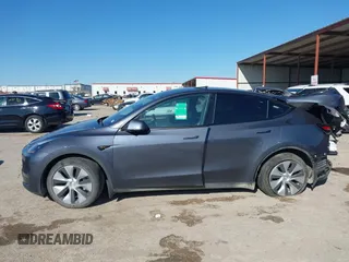 2023 Tesla Model Y Long Range with VIN 7SAYGAEE8PF667728, listed as a IAAI auction lot 41839771 with 32,654 mi miles and . Bid and sale history available at DreamBid. Image 14.