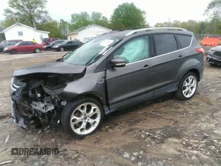 2013 Ford Escape Titanium with VIN 1FMCU0J92DUC70534, listed as a IAAI auction lot 41967096 with 77,921 mi miles and . Bid and sale history available at carsss.com. Image 2.