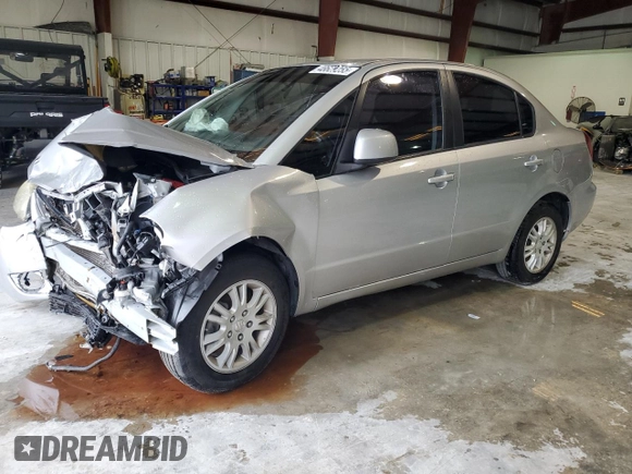 2012 Suzuki SX4 LE z VIN JS2YC5A34C6304150, wystawiony jako Copart lot #48629255 z przebiegiem 104 658 mil mil oraz Szkoda całkowita • Salvage title. Historia ofert i sprzedaży dostępna na DreamBid. Obrazek 1.