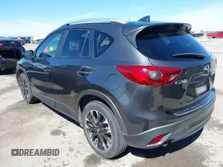 2016 Mazda CX-5 Grand Touring with VIN JM3KE2DY9G0824196, listed as a IAAI auction lot 41801887 with 88,625 mi miles. Bid and sale history available at carsss.com. Image 3.