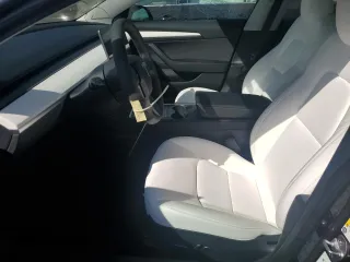 2023 Tesla Model 3 Long Range with VIN 5YJ3E1EBXPF660900, listed as a Copart auction lot 48923265 with 9,954 mi miles and Salvage Title. Bid and sale history available at DreamBid. Image 7.