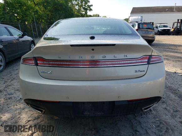2015 Lincoln MKZ z VIN 3LN6L2JK4FR629312, wystawiony jako Copart lot #60230405 z przebiegiem 79 570 mil mil oraz Szkoda całkowita • Salvage title. Historia ofert i sprzedaży dostępna na DreamBid. Obrazek 6.