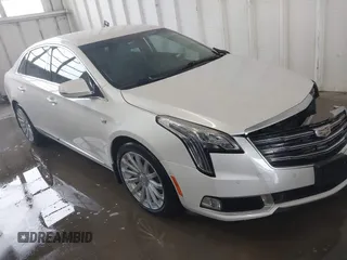 2018 Cadillac XTS Luxury z VIN 2G61M5S38J9156679, wystawiony jako IAAI lot #41574733 z przebiegiem 65 637 mil mil oraz . Historia ofert i sprzedaży dostępna na DreamBid. Obrazek 1.